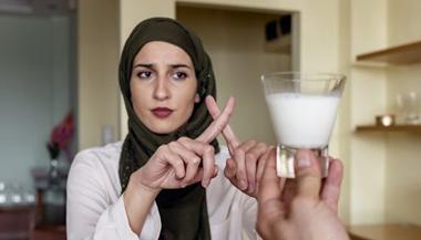 Woman rejecting milk