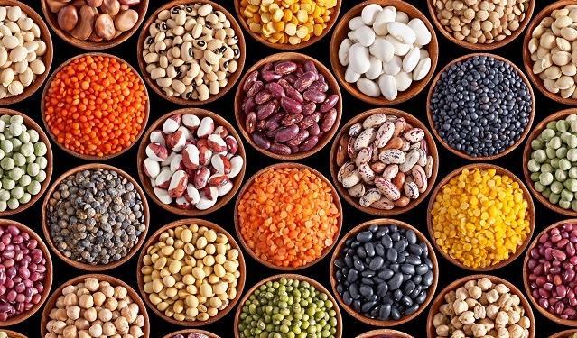 Many varieties of dried legumes in tiled pattern